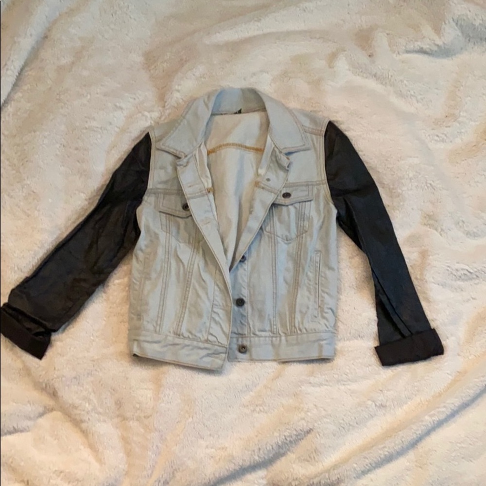 Denim jacket with leather sleeves